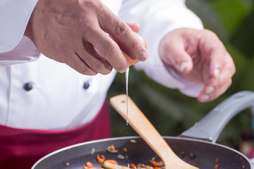 Obraz na płótnie Canvas Chef putting egg for cooking Pad Thai