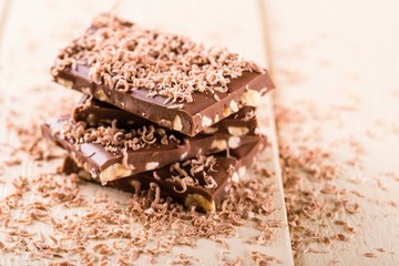 Stack from chocolate with nuts covered by shavings