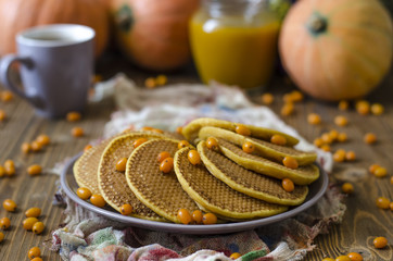 Pumpkin pancakes with sea buckthorn sauce for breakfast  