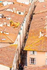 Aerial cityscape view on the narrow street in the old town of Lucca in Italy