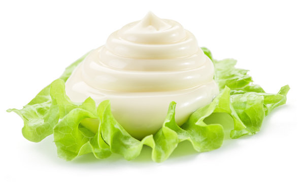 Natural mayonnaise sauce on the salad leaf.
