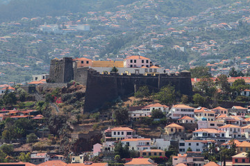 Fototapeta na wymiar Ancient fortress and city. Funchal, Madeira, Portugal