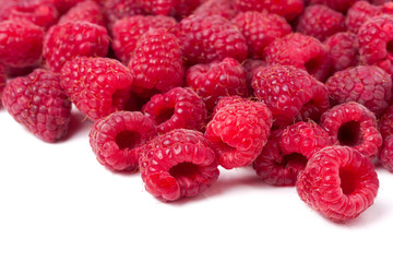 many raspberries isolated on a white background