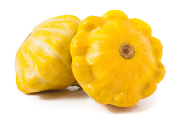 two yellow pattypan squash isolated on white background