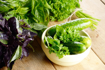 Organic Cucumbers and basil leaves