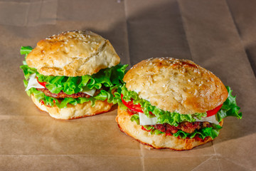 Fresh hamburgers on craft paper