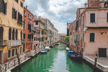 Fototapeta na wymiar Canal, boats and houses in Venice