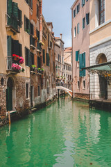 Fototapeta na wymiar Canal, boat and houses in Venice