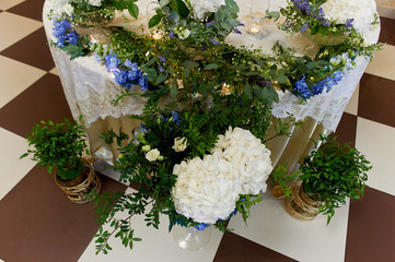 Wedding table decoration white and blue hydrangeas. Floral