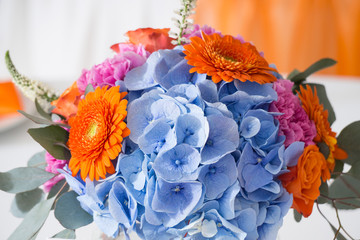 Wedding decorations with colorful flowers, napkins, tapes and ta