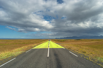 Isolated road and Icelandic colorful landscape at Iceland, summe