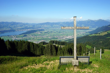 Wooden cross and lake