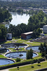 Sewage water treatment plant with river in background aerial view