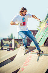 Skateboarder riding in skate park