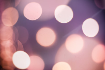 Christmas shiny light bokeh in violet pink colors, vintage retro hipster seasonal holiday background