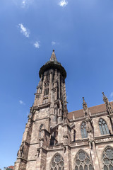 Fototapeta na wymiar Main tower of world famous Freiburg Muenster cathedral, a mediev
