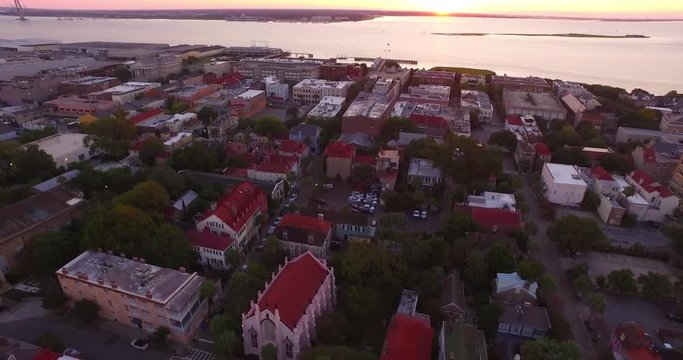 Aerial perspective of the St. Philip&rsquo;s Episcopal Church and French Huguenot Church in downtown Charleston, SC, as well as the Arthur Ravenel Jr. Bridge.