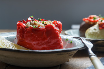 Baked red pepper stuffed with rice, peanuts and prunes. Traditional Greek Gemista.