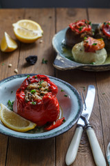 Bell peppers stuffed with rice and sauce on plate, selective focus