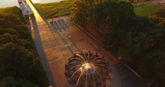 Aerial perspective of the Waterfront Park water fountain in historic Downtown Charleston, South Carolina, near the Charleston Harbor and pier.