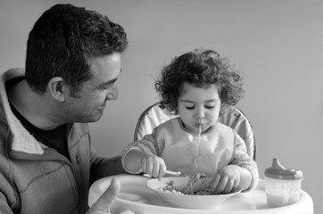 Father and child having meal together