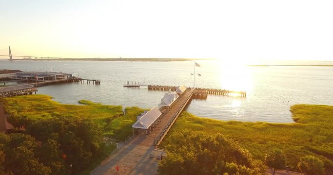 Aerial perspective of the Waterfront Park water fountain in historic Downtown Charleston, South Carolina, near the Charleston Harbor and pier.