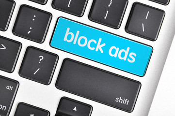 The computer keyboard button written word block ads