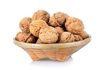 walnut in basket on white background