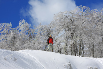 Happy Snowboarder Wearing Gear Ready to Drop in on the Snowy Mountain of Nevados de Chillan in Las...