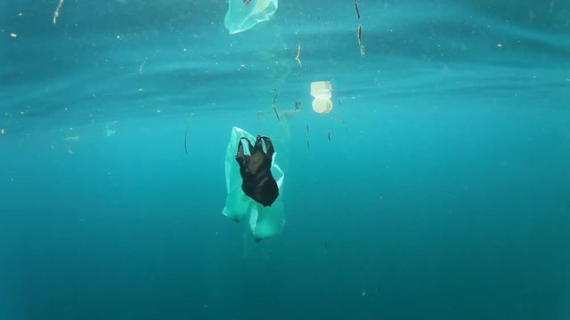 Plastic bags pollution in sea ocean