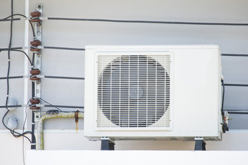 Fototapeta premium air-conditioner mounted outside on a wall