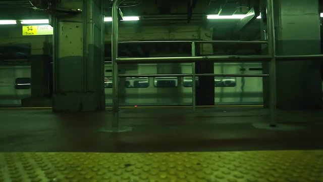 Cool shot of train passing by at underground subway station