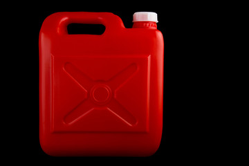 Red Plastic Liquids Container on a Black Background