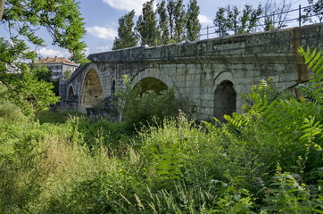 Medieval one hundred meter long stone Kadin bridge build  over  the river Struma, Nevestino village, Bulgaria 