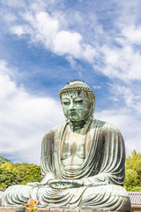 The Great Buddha in Kamakura. Pigeon is resting on top of the Great Buddha's head.