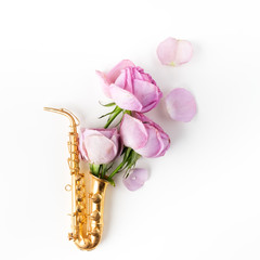 Jazz Day. Saxophone with flowers. Flat lay, top view