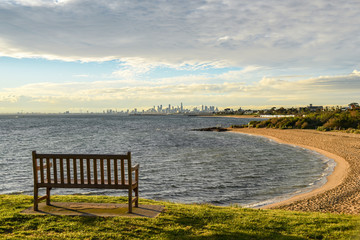 Fototapeta na wymiar Wooden bench near Brighton beach, Melbourne