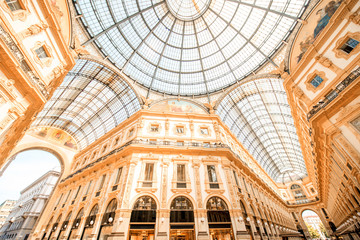 Interior with beautiful glass vaults in the famous Vittorio Emanuele shopping gallery in the center of Milan city.