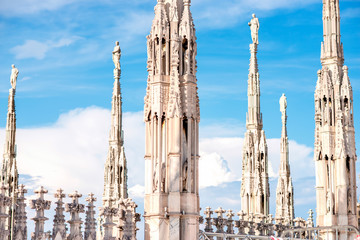 Gothic spires on Duomo rooftop's spires in Milan