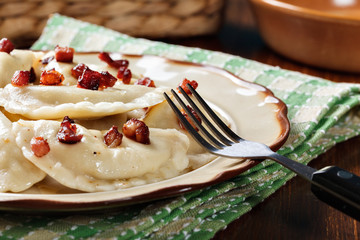 Dumplings with meat or cabbage and mushroom or cheese seasoned fried bacon