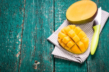 Fresh rip mango on a wooden background.Healthy food