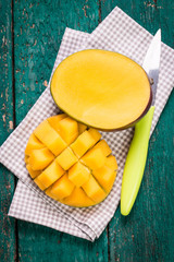 Fresh rip mango on a wooden background.Healthy food
