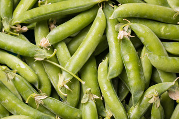 green peas on wooden table ,healthy concept