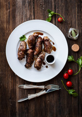 beef stuffed with mushrooms in a bowl on a wooden table