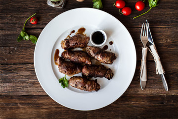 beef stuffed with mushrooms in a bowl on a wooden table
