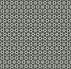 Black and white monochrome seamless pattern background made of repeating scanned elements of handmade crochet lace