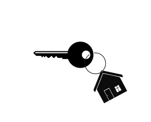 House key on a house shaped keychain. concept for real estate, moving home or renting property