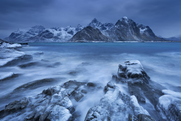Dark clouds over a fjord in Norway in winter - 120237573