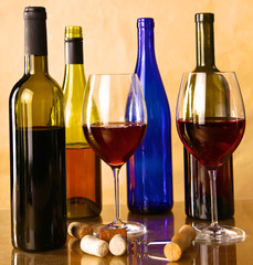 wine bottle and glass on a table