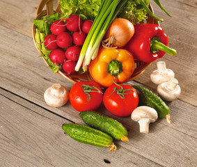 Composition with assorted raw organic vegetables wooden table